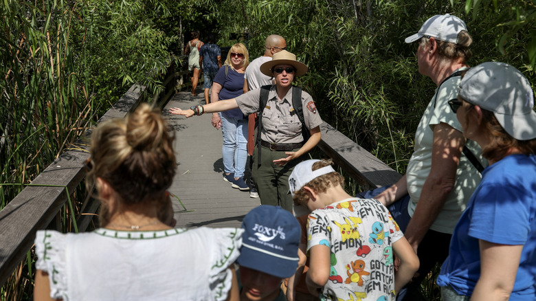 Park ranger speaking to visitors in Florida's everglades