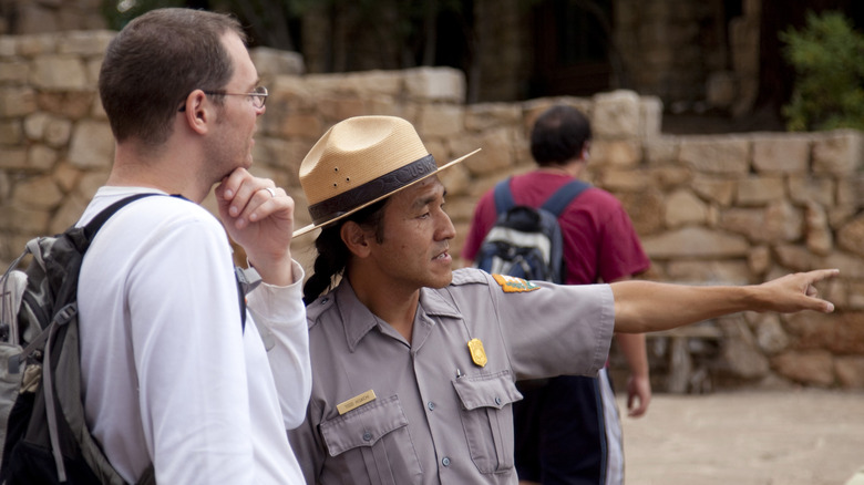 Park ranger assisting visitor