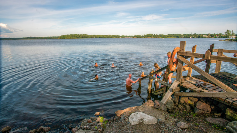 People swimming in a lake in Finland.