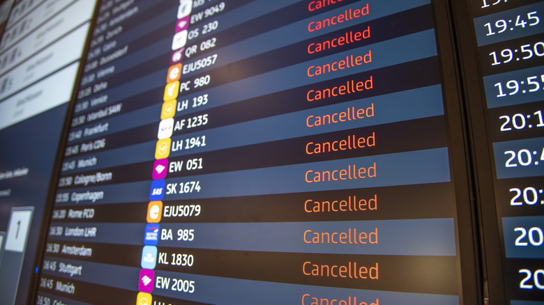 An airport flight board showing all "cancelled" flights