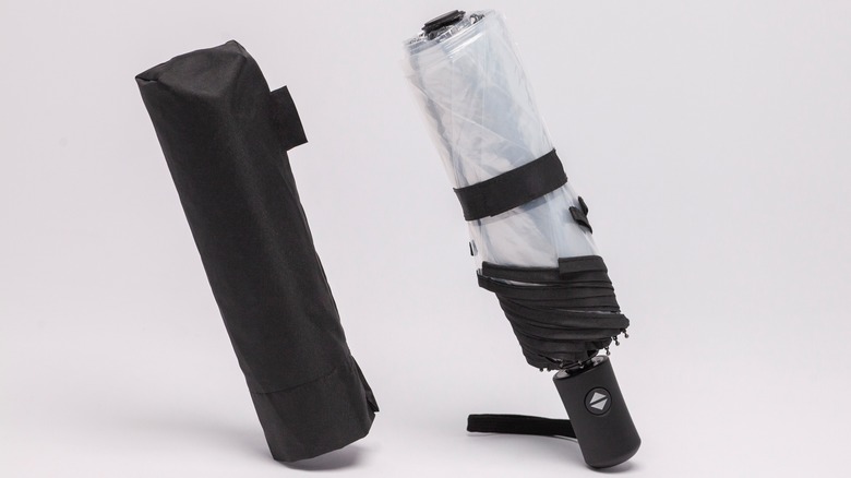a foldable umbrella with its own bag