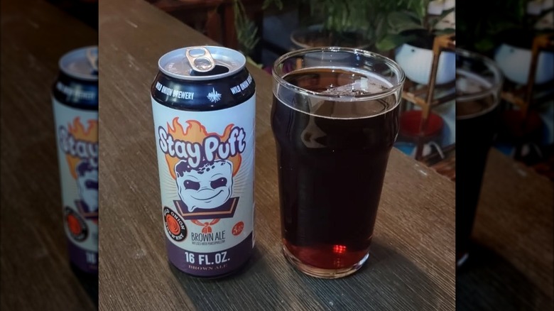 a photo of a glass of beer and a beer can from Wild Onion Brewery