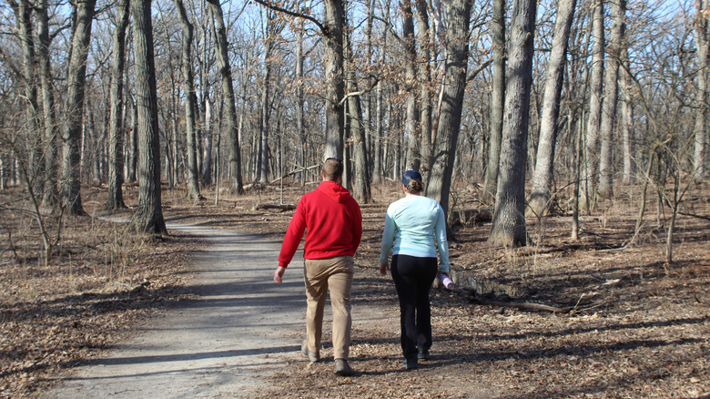 Man and woman walking on the Sag Valley Trail at Cherry Hill Woods in Palos Park, Illinois
