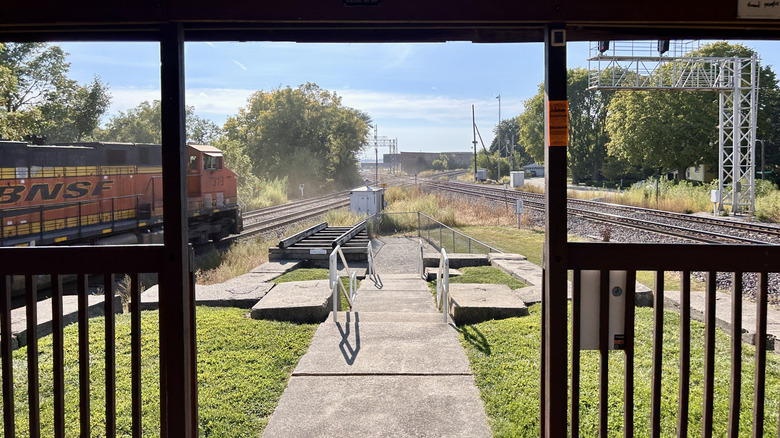 A train approaches the crossroads at Rochelle Railroad Park, Rochelle, Illinois