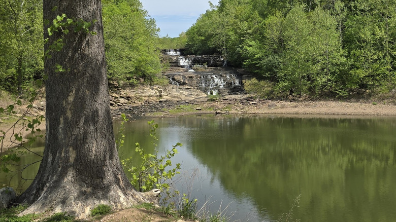 Distant view of waterfall behind the swimming hole at Kinkaid Spillway in Illinois