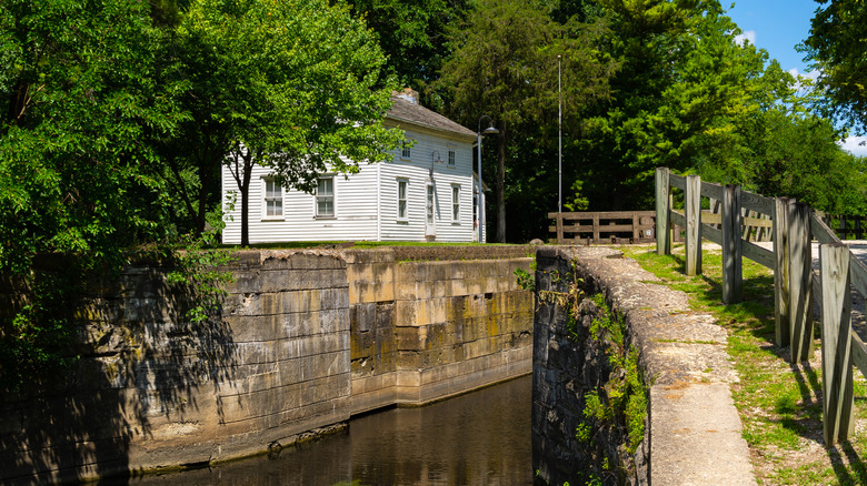 White historic building next to the I & M Canal in Channahon State Park