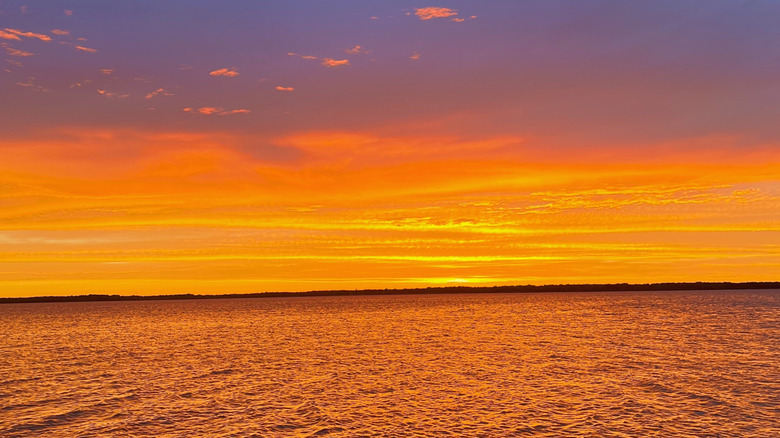 Sunset at Carlyle Lake, Illinois, with fiery colors reflecting in the water