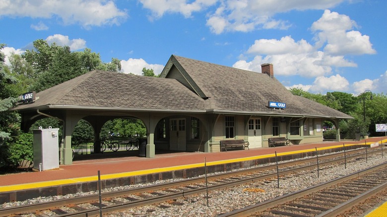 The exterior of the Golf, Illinois Metra station on a sunny summer day