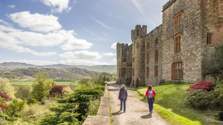 Visitors exploring the grounds of Muncaster Castle.