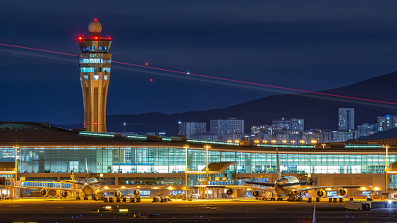 An aerial view of South Korea's Incheon Airport and the air traffic control tower at night