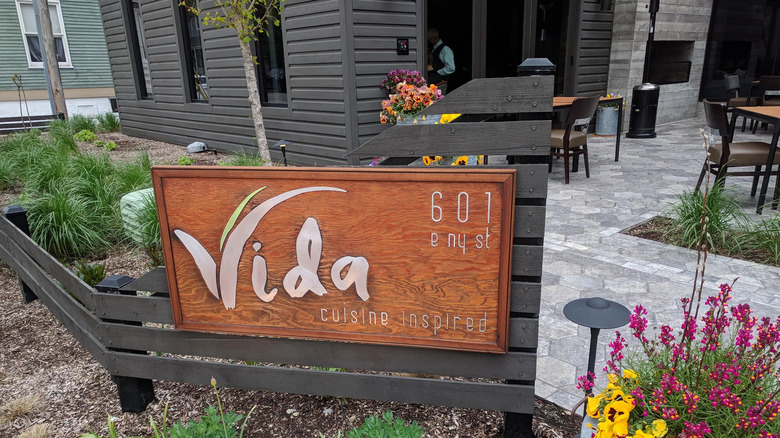 Vida sign and outside patio with plants