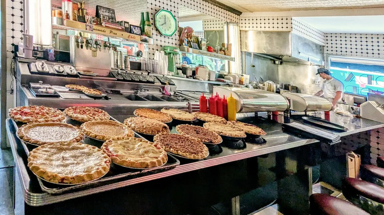 A diner display showing different kinds of homemade pies.