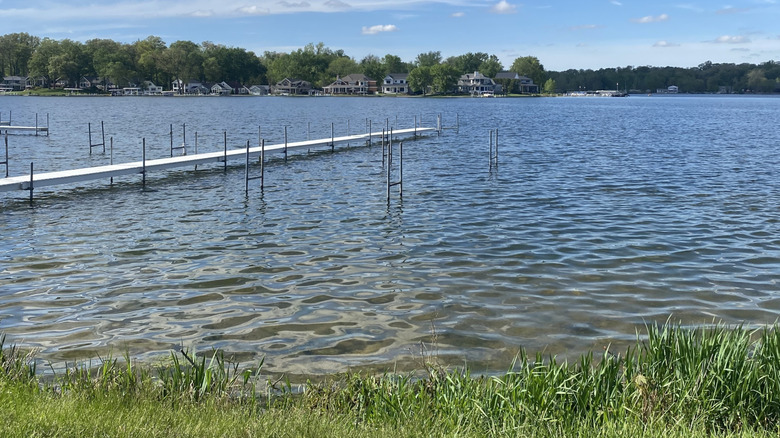 Long dock on calm waters of Tippecanoe Lake in the summer.
