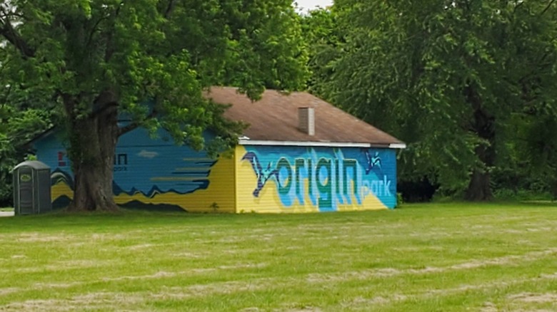 A mural for Origin Park on a building within the park