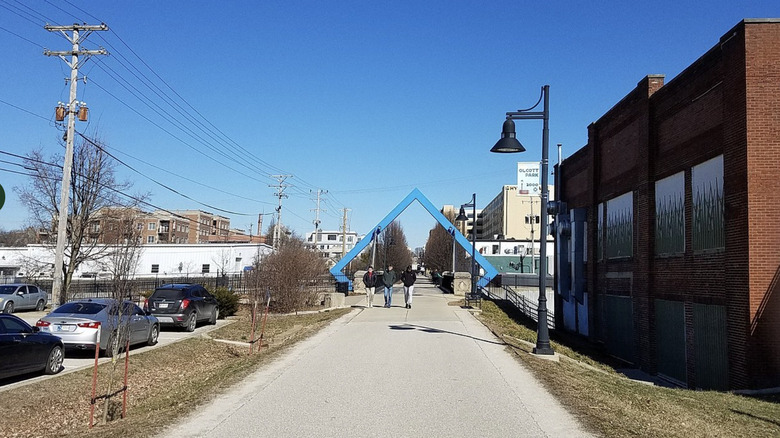 People walking on the B-line trail on a sunny, cloudless day in Bloomington, Indiana