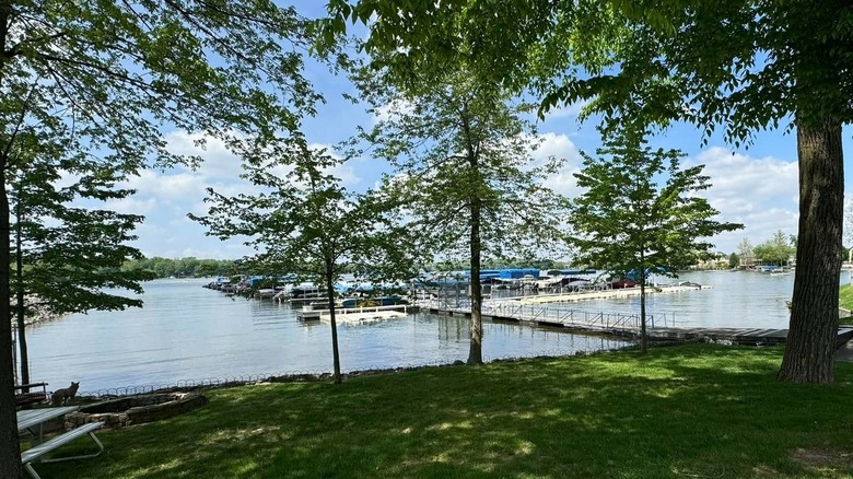 View of the Geist Reservoir boat docks and trees along the water