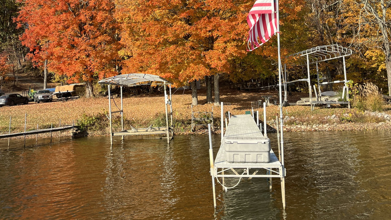 A pier stretches into the waters of Lake Lemon on a bright autumn day