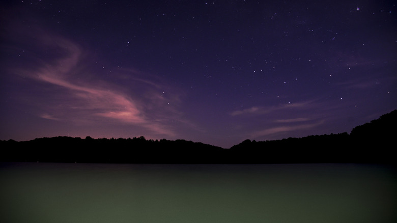 The night sky over a lake in Hoosier National Forest, Indiana