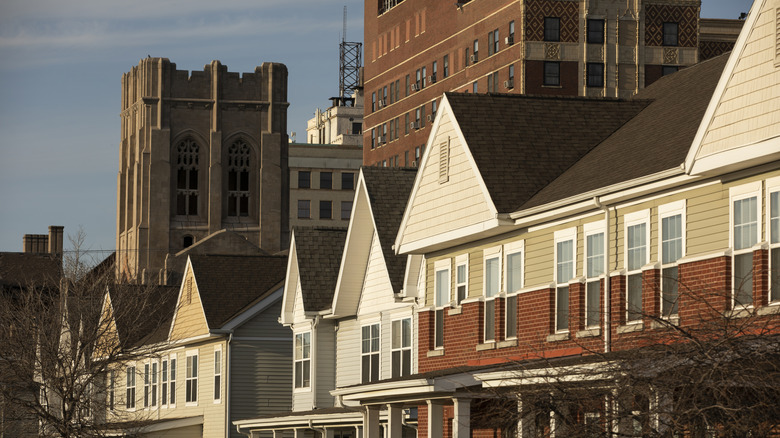 Row houses with downtown skyline behind