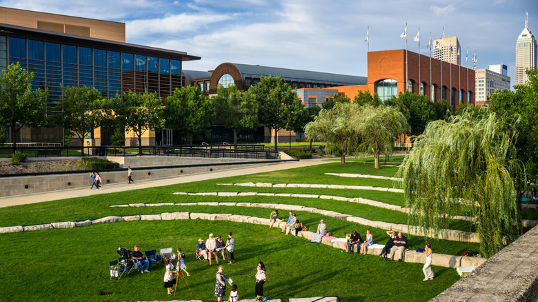 People at an outdoor amphitheater in White River State Park in Indianapolis, Indiana