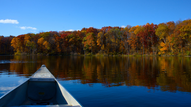 A canoe crosses Mud Lake at Chain O' Lakes State Park, Indiana