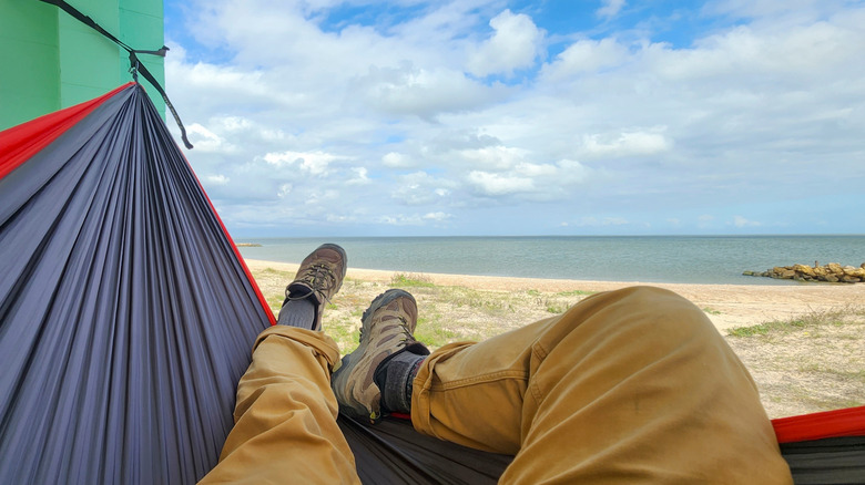 Person lounging on beach along Matagorda Bay