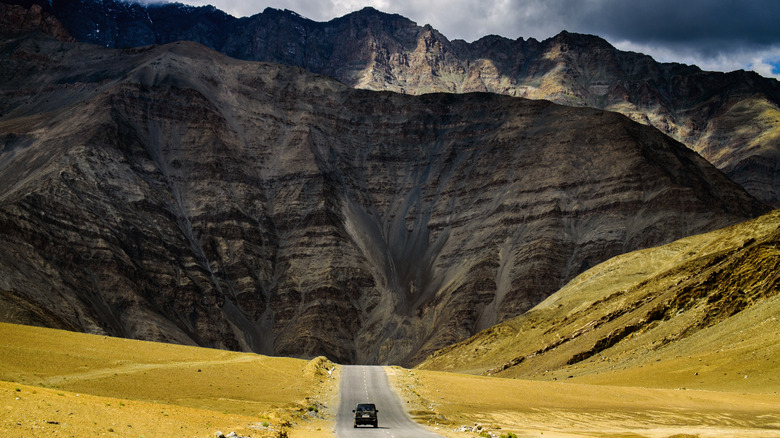 Car driving towards Magnetic Hill, Ladakh
