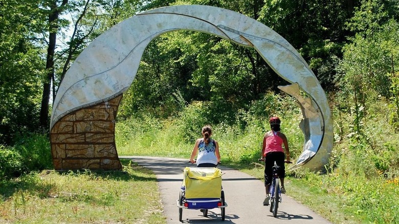 two cyclists pass along the Trout Run Trail Loop
