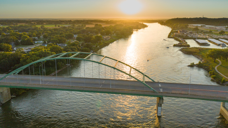 A view of a bridge over the river in Sioux City at sunset