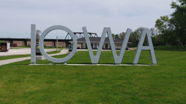 "Iowa" sculpture in front of a trestle in Manning, Iowa