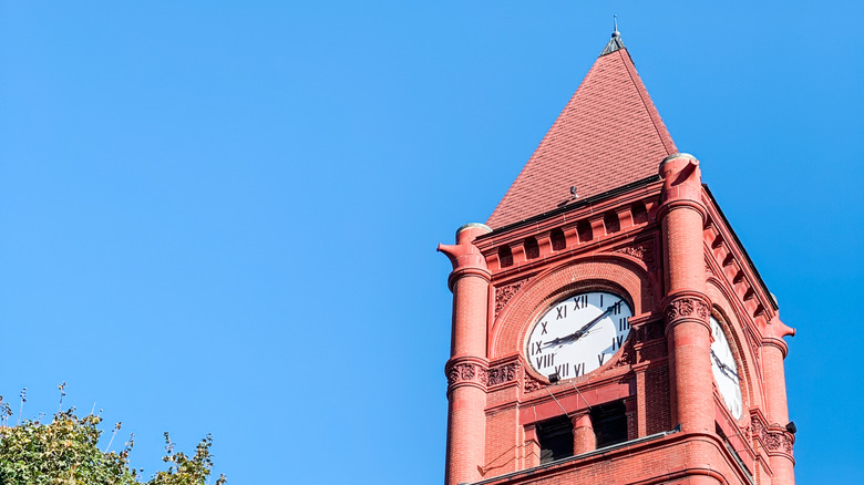 A clocktower against a clear blue sky.