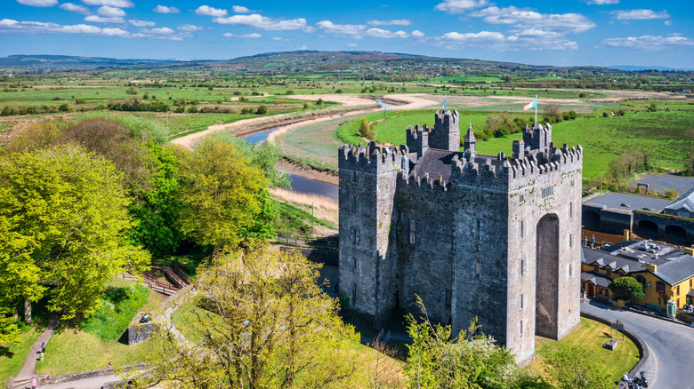 Aerial view of Bunratty Castle and surrounding fields on a sunny day