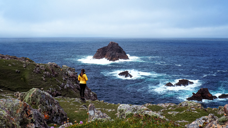A hiker on the Erris Head Loop trail in County Mayo, Ireland