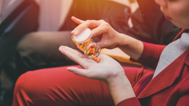 A person taking pills