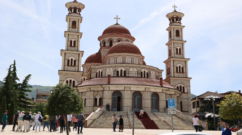 The Resurrection Cathedral rises out of a well trafficked plaza in Korca, Albania