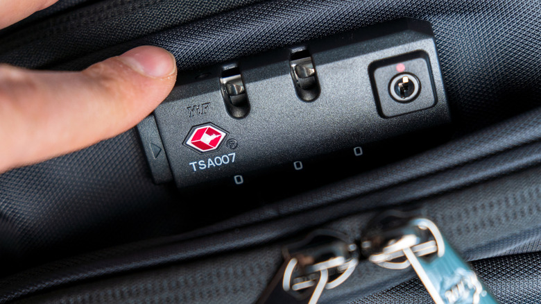 Suitcase with a TSA-approved lock with logo