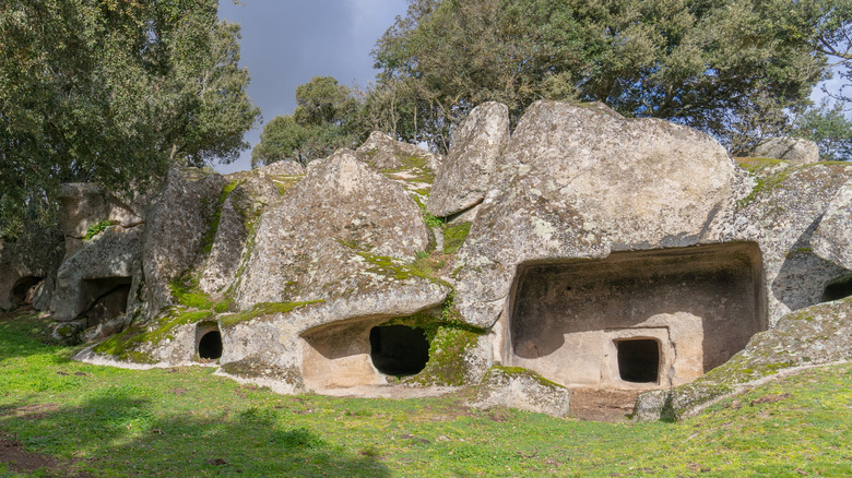 Ancient rock chambers, domus de janus, with openings in Sardinia, Italy.