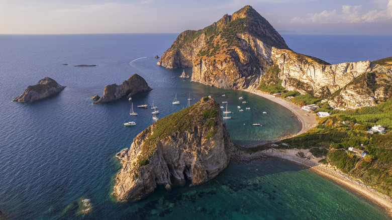 The Italian island of Palmarola with a curving beach and turquoise water