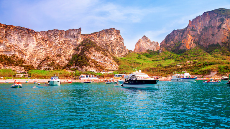 Boats docked near a beach on the Italian island of Palmarola