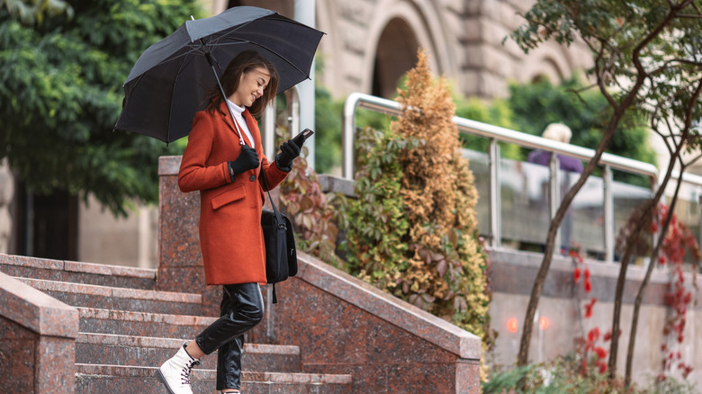Woman walking with an umbrella