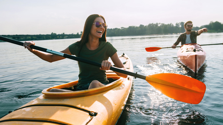People kayaking on lake