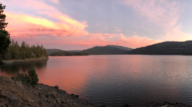 A pink and orange sunset across Jackson Meadow Reservoir