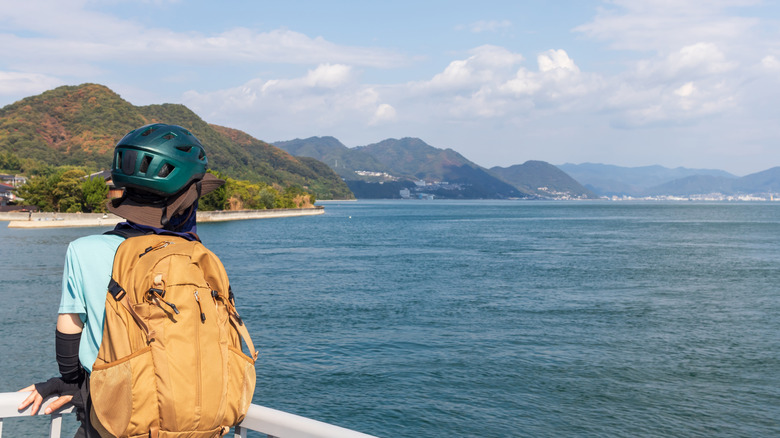 A cyclist pauses to look out to Seto Inland Sea on Ikuchijima