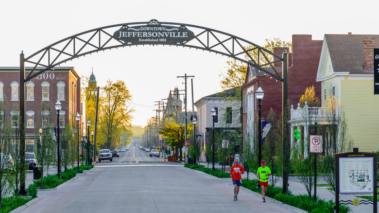 Two people running through downtown Jeffersonville