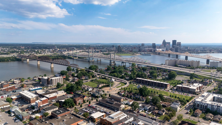 Aerial view of buildings, bridges, and a river in Jeffersonville, Indiana.