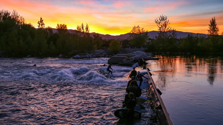 Surfing at sunset on the Boise River in Garden City, Idaho