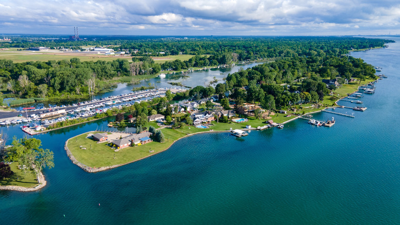 An aerial view of Grosse Ile, Michigan with homes, boats, and shoreline