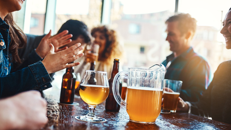 Friends enjoying beer around a table