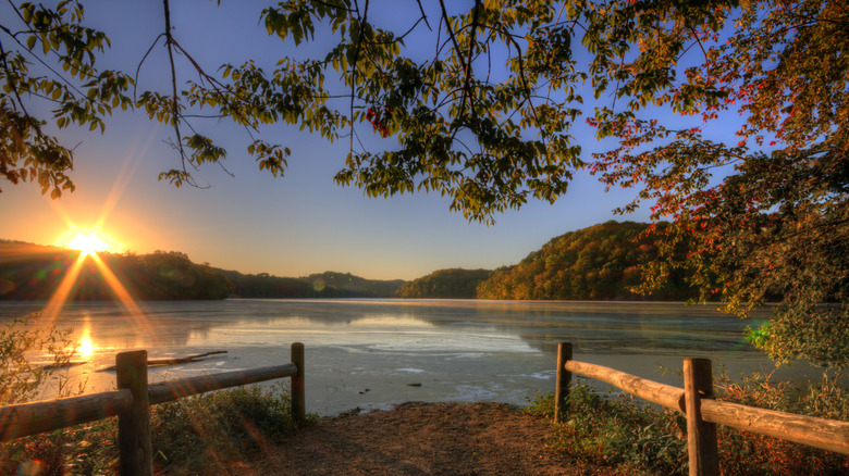 Sunrise over Radnor Lake with fall foliage