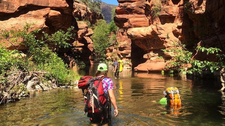 People walking through West Clear Creek